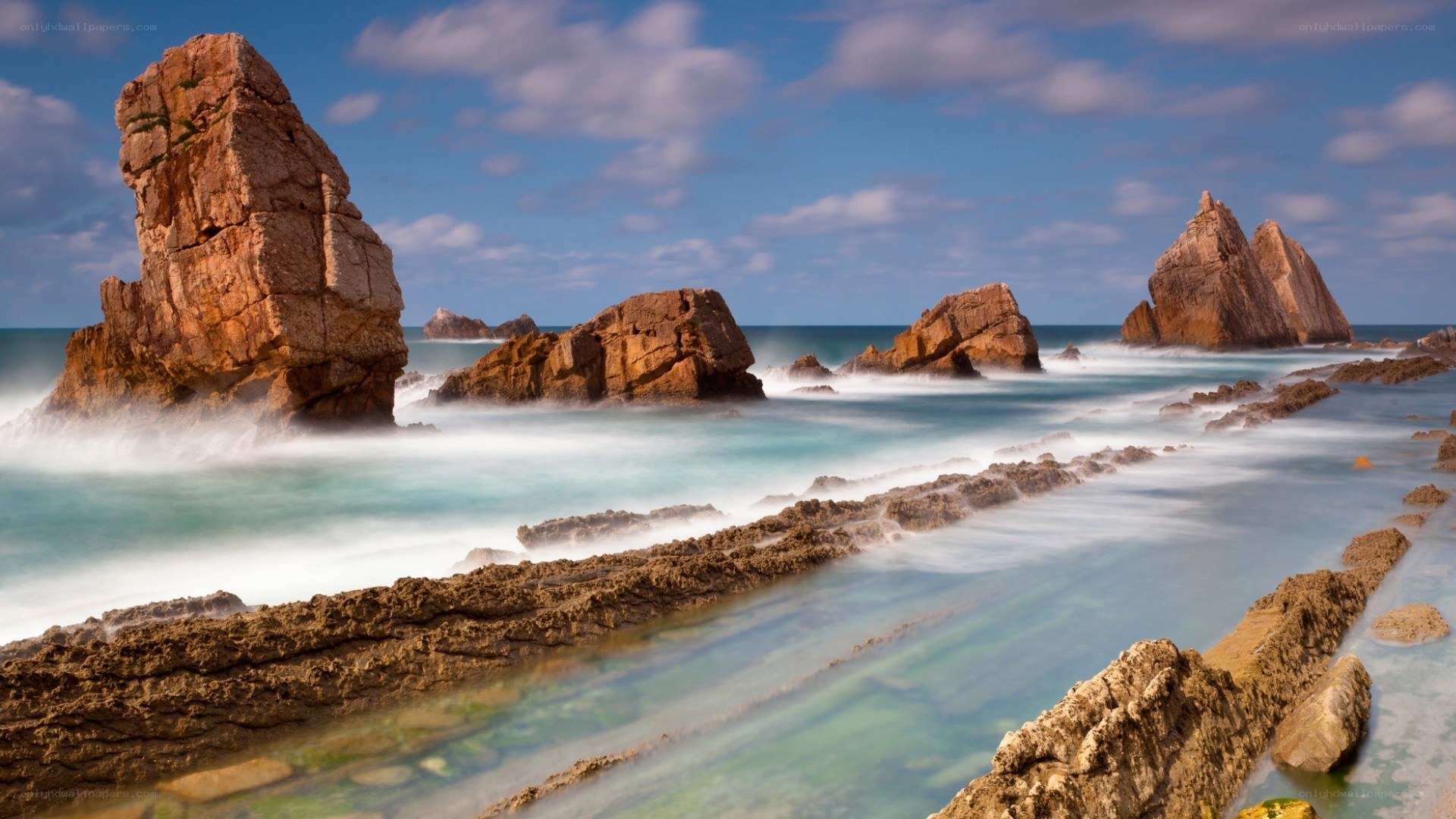 Rocky coastline with sea waves