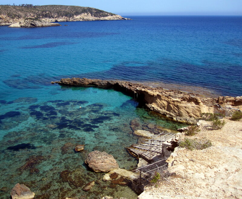 Rocky Cove with Clear Water — Blue, Serene, Afternoon, Photograph, Rocks