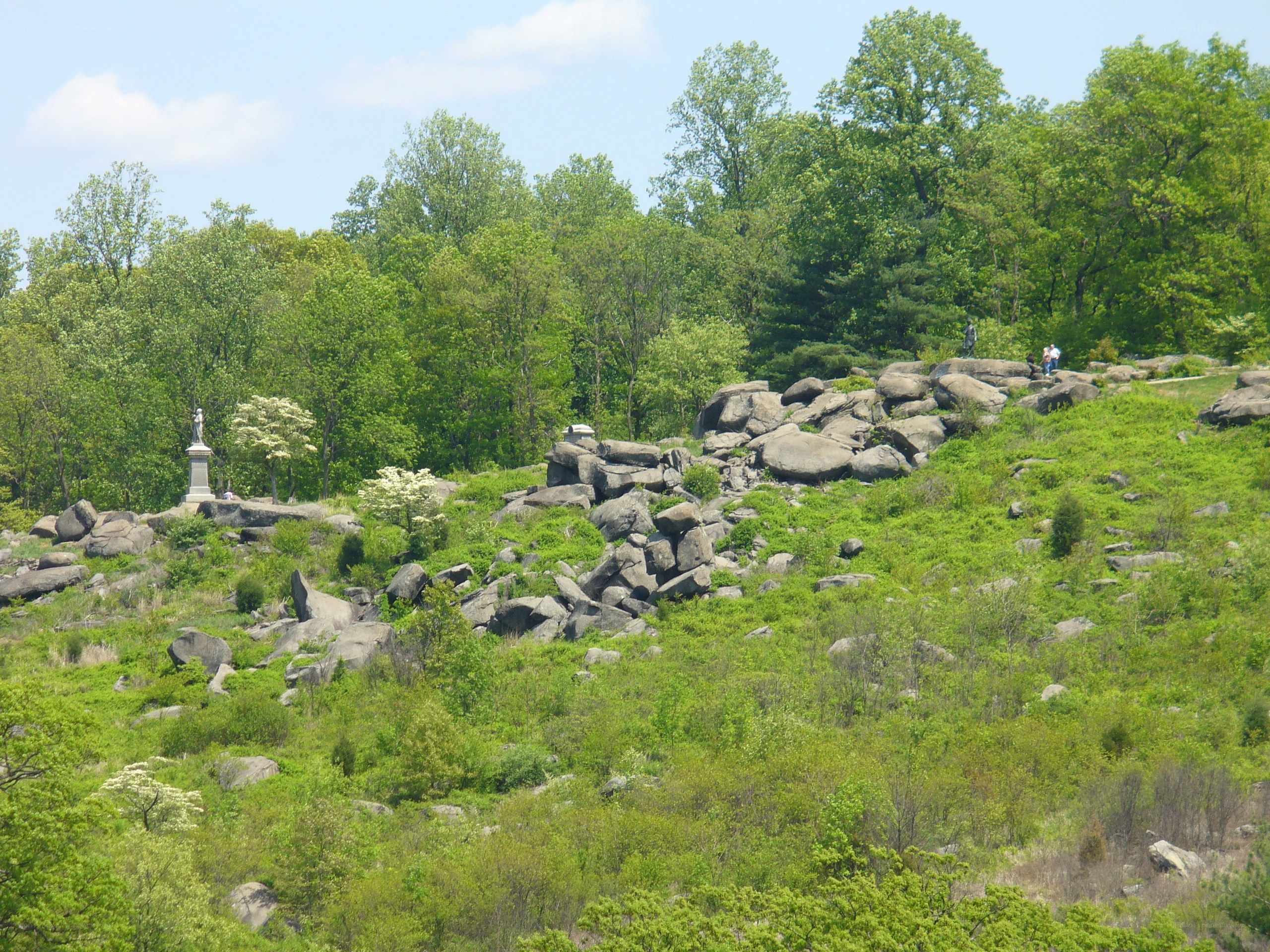 rocky hill with monument