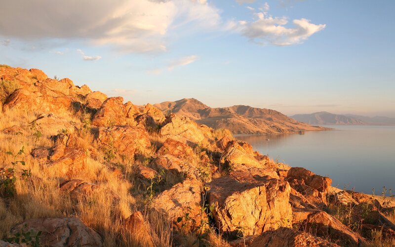 Rocky Hillside by Lake — Serene