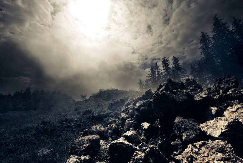Rocky Hillside under Cloudy Sky — Gray