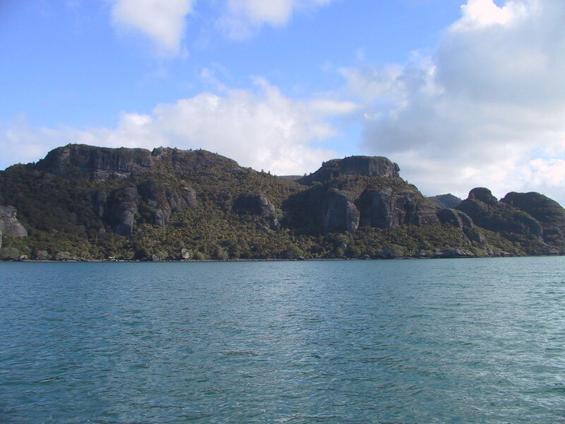 rocky island in blue water