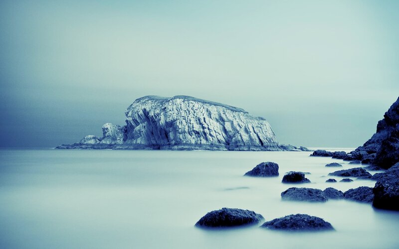 Rocky island in calm sea