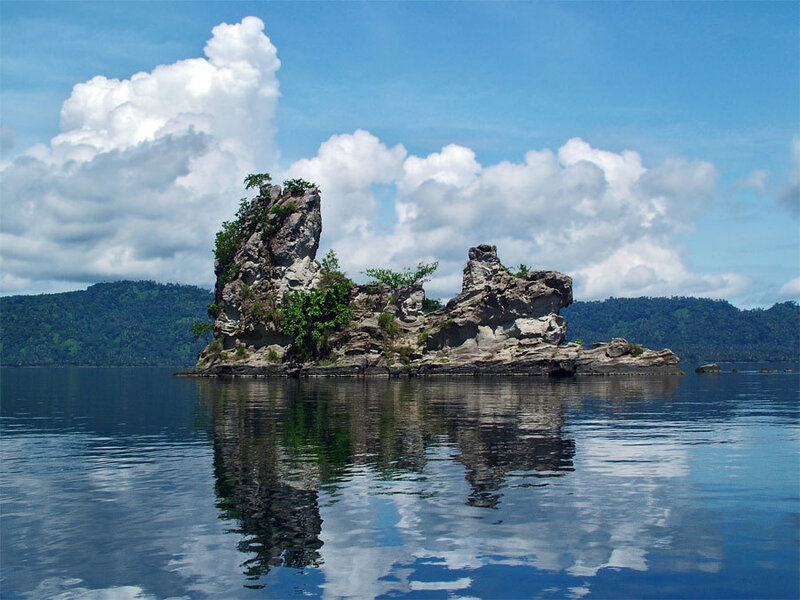 Rocky island in calm waters