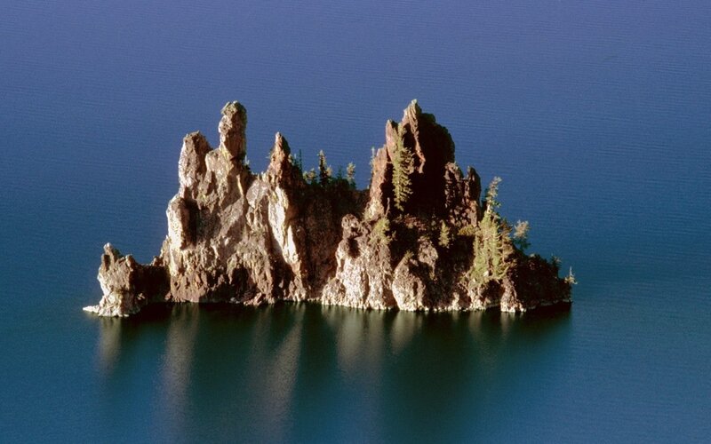 Rocky Island in Lake — Blue