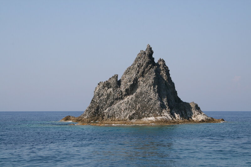 Rocky Island in Ocean — Blue, Serene, Afternoon, Photograph