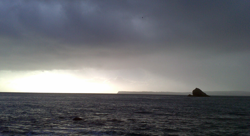 Rocky Island in Ocean — Gray, Dramatic