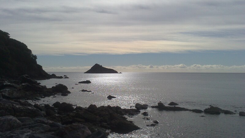 Rocky Island in Sea — Gray, Calm