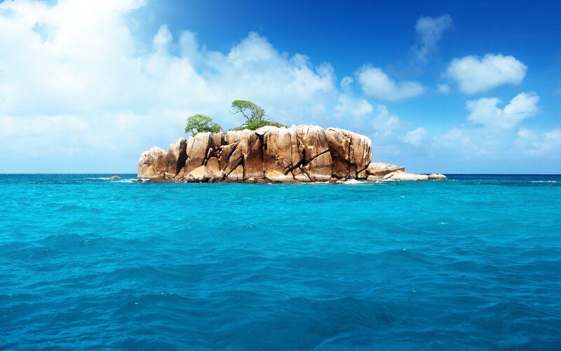 Rocky island in turquoise sea