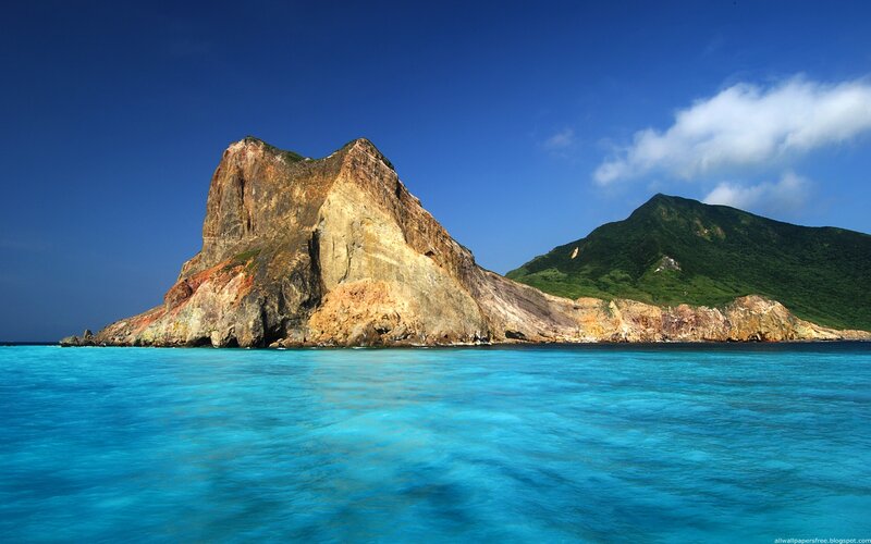 Rocky island in turquoise water
