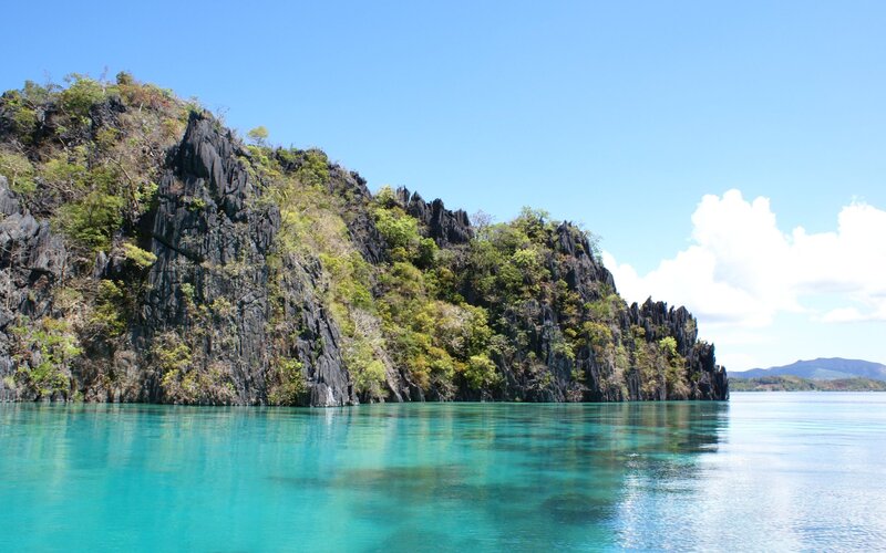 Rocky Island in Turquoise Water — Blue