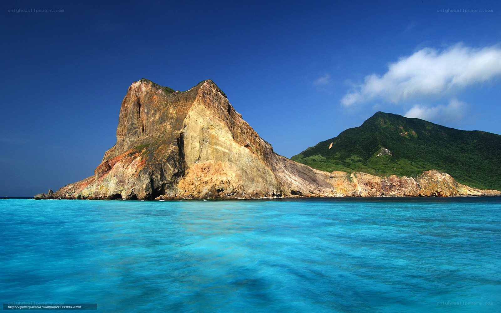 Rocky island in turquoise water
