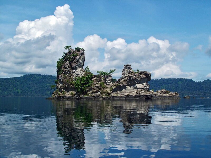 Rocky Island in Water — Blue