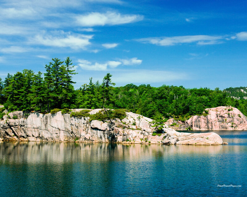 Rocky island with forest and lake