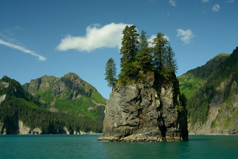 Rocky Island with Trees — Blue, Serene, Afternoon, Photograph, Mountains