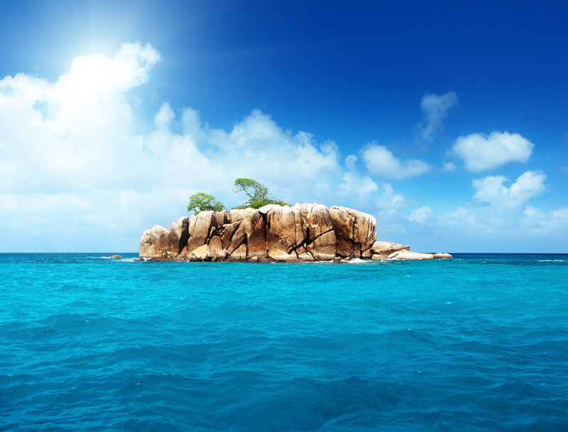 Rocky Island with Trees — Blue, Serene, Afternoon, Photograph, Ocean