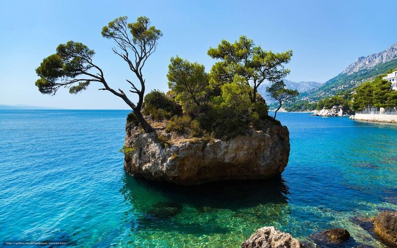 Rocky Island with Trees — Blue, Serene, Afternoon, Photograph, Sea, Mountain, Green