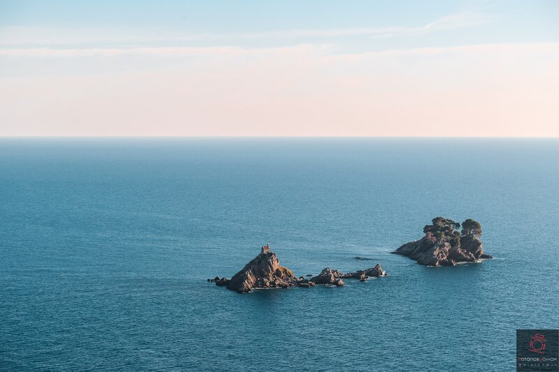 Rocky Islands in Sea — Blue, Serene, Sunset