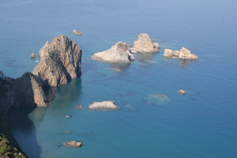 Rocky Islets in Blue Sea — Serene