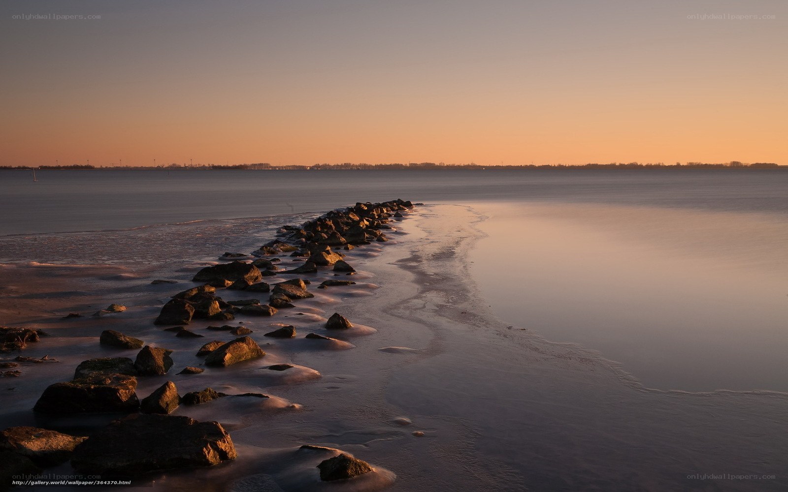 Rocky jetty at sunset