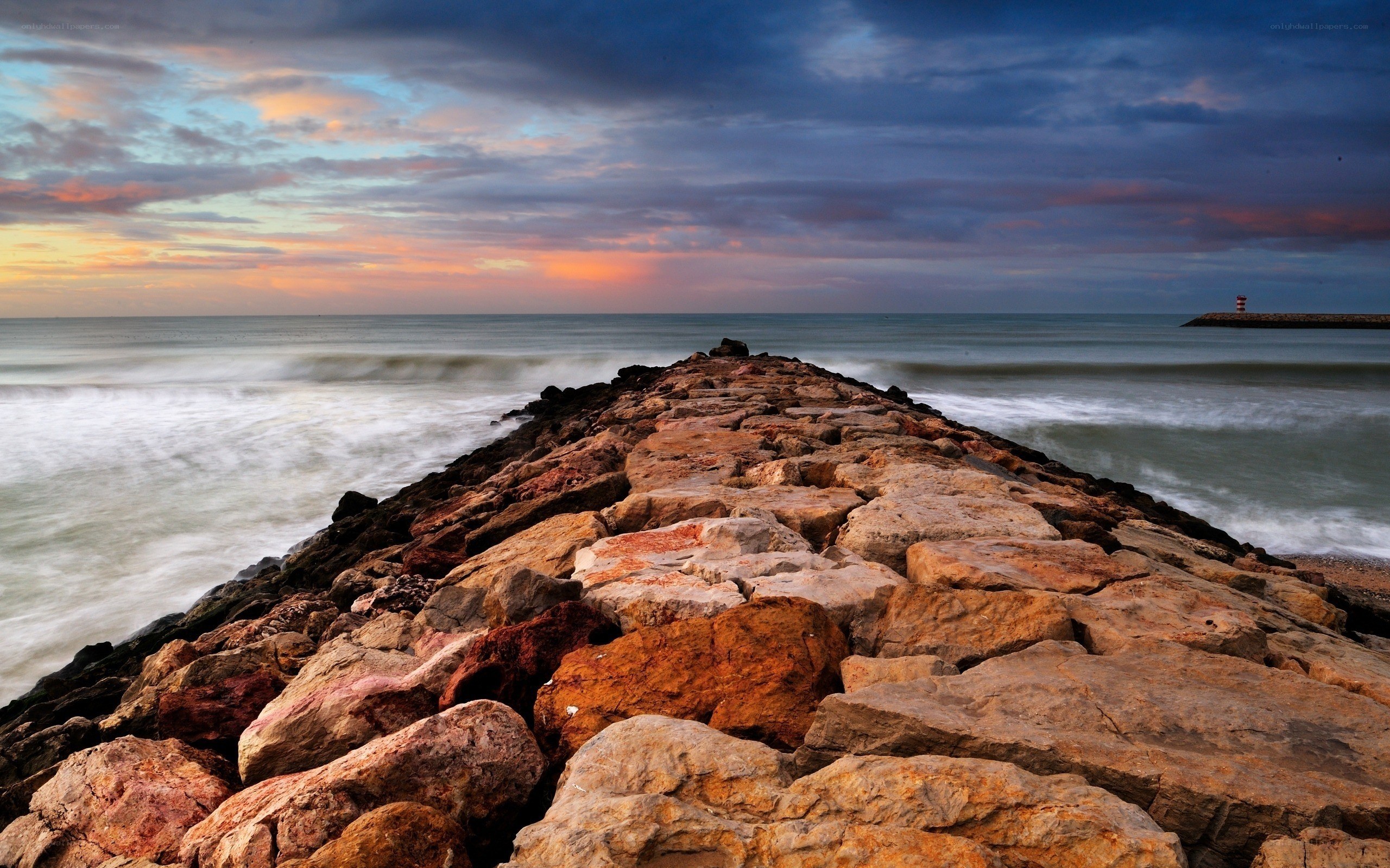 Rocky jetty at sunset