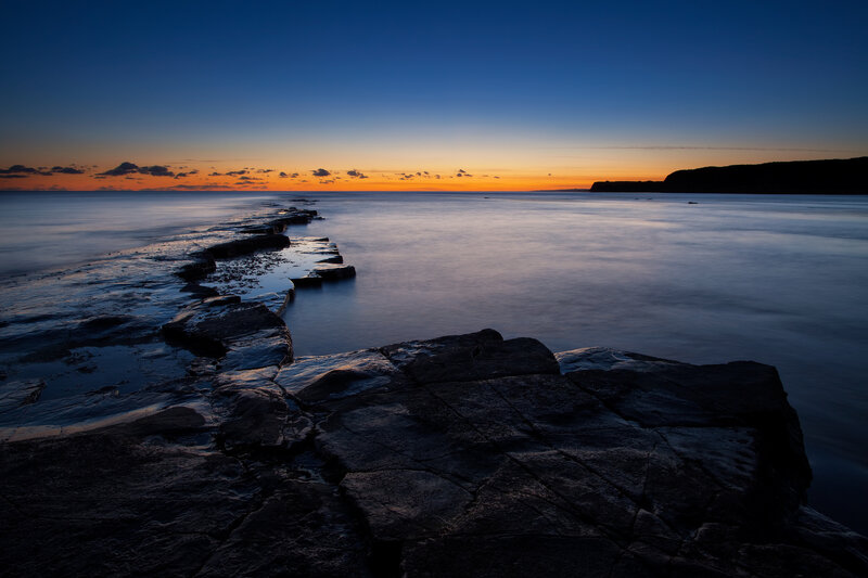 Rocky Jetty at Sunset — Blue, Serene