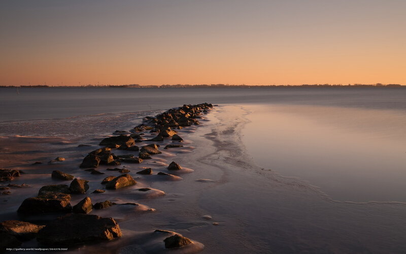 Rocky Jetty at Sunset — Orange, Serene, Photograph