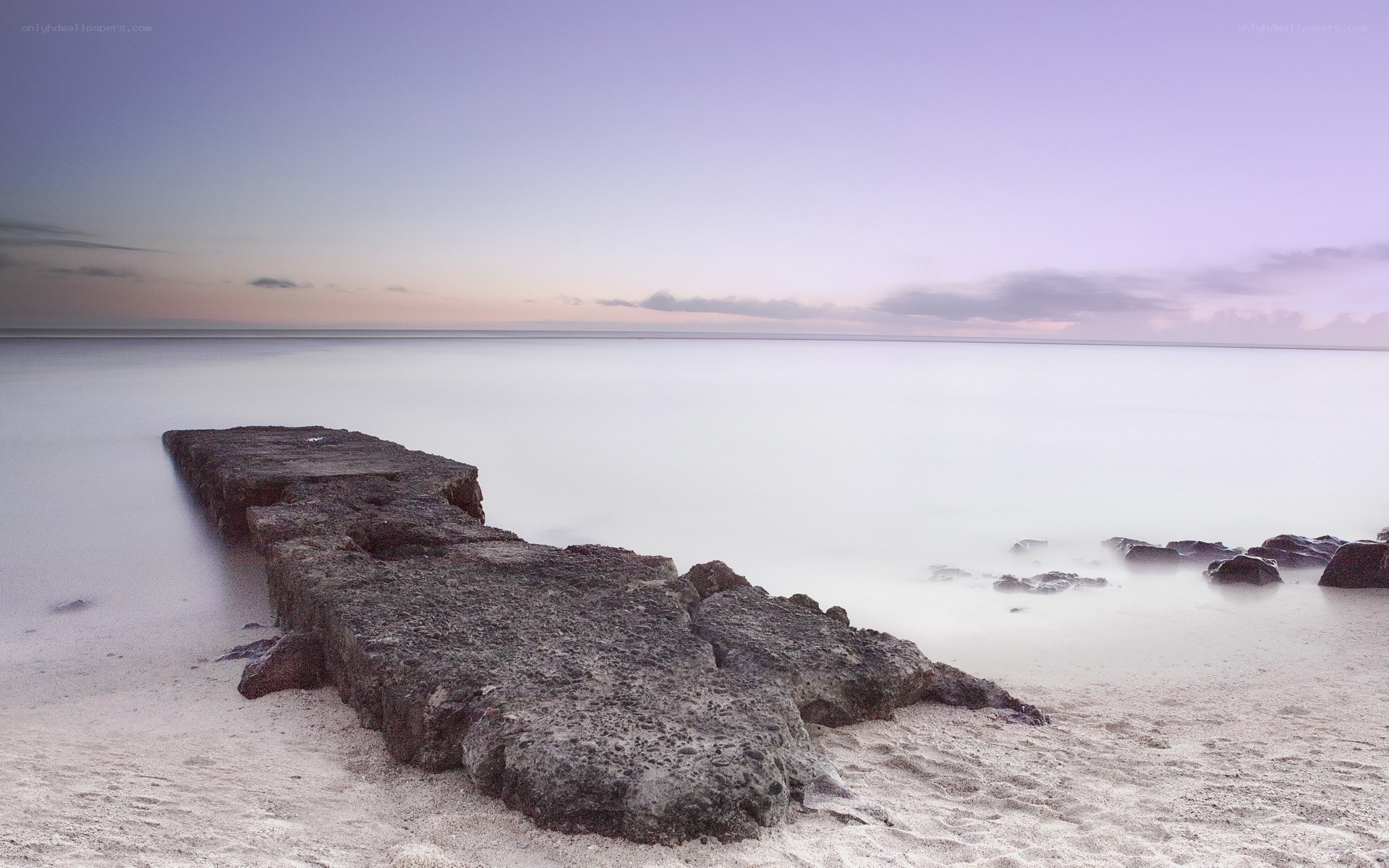 Rocky jetty at twilight
