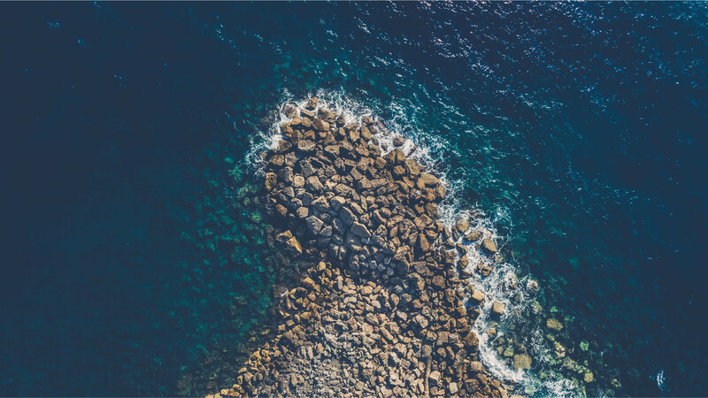 Rocky Jetty in Ocean — Blue, Serene