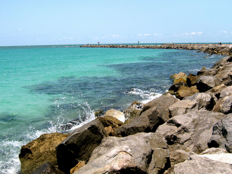 Rocky Jetty in Ocean — Blue