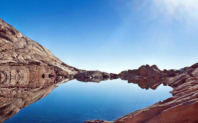 Rocky lake under clear sky