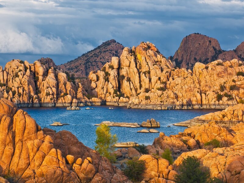 Rocky landscape with lake at sunset