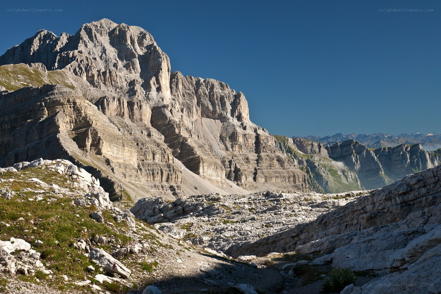 Rocky mountain peak under blue sky
