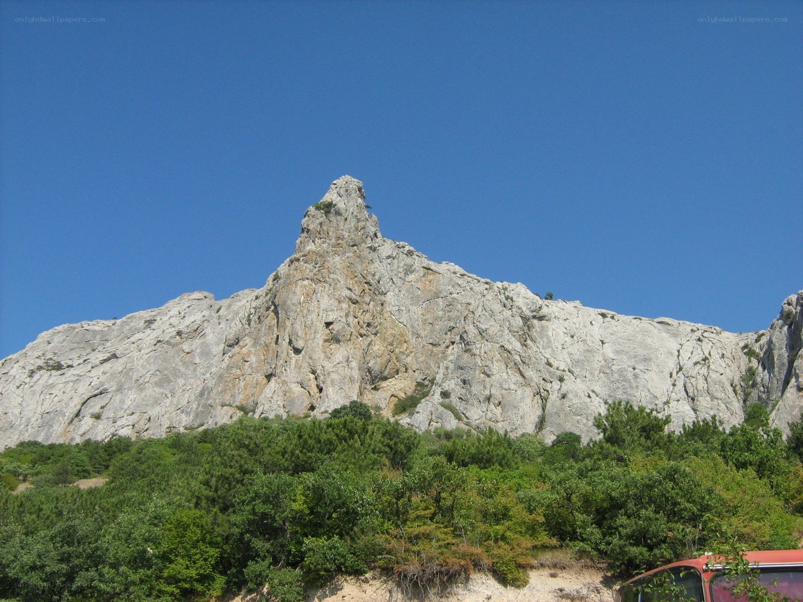 Rocky mountain peak under blue sky