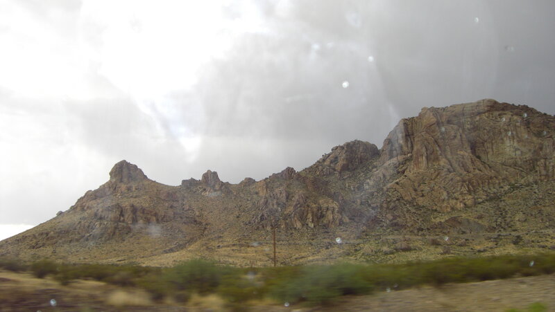 rocky mountains under cloudy sky
