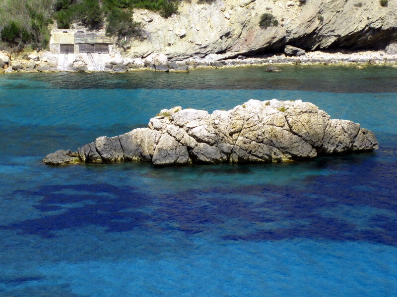 Rocky Outcrop in Sea — Blue, Serene