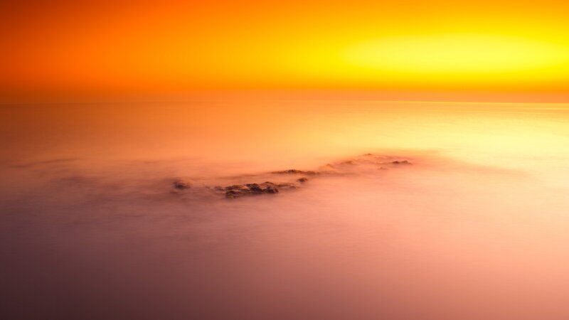 Rocky Outcrop in Sea — Orange, Serene