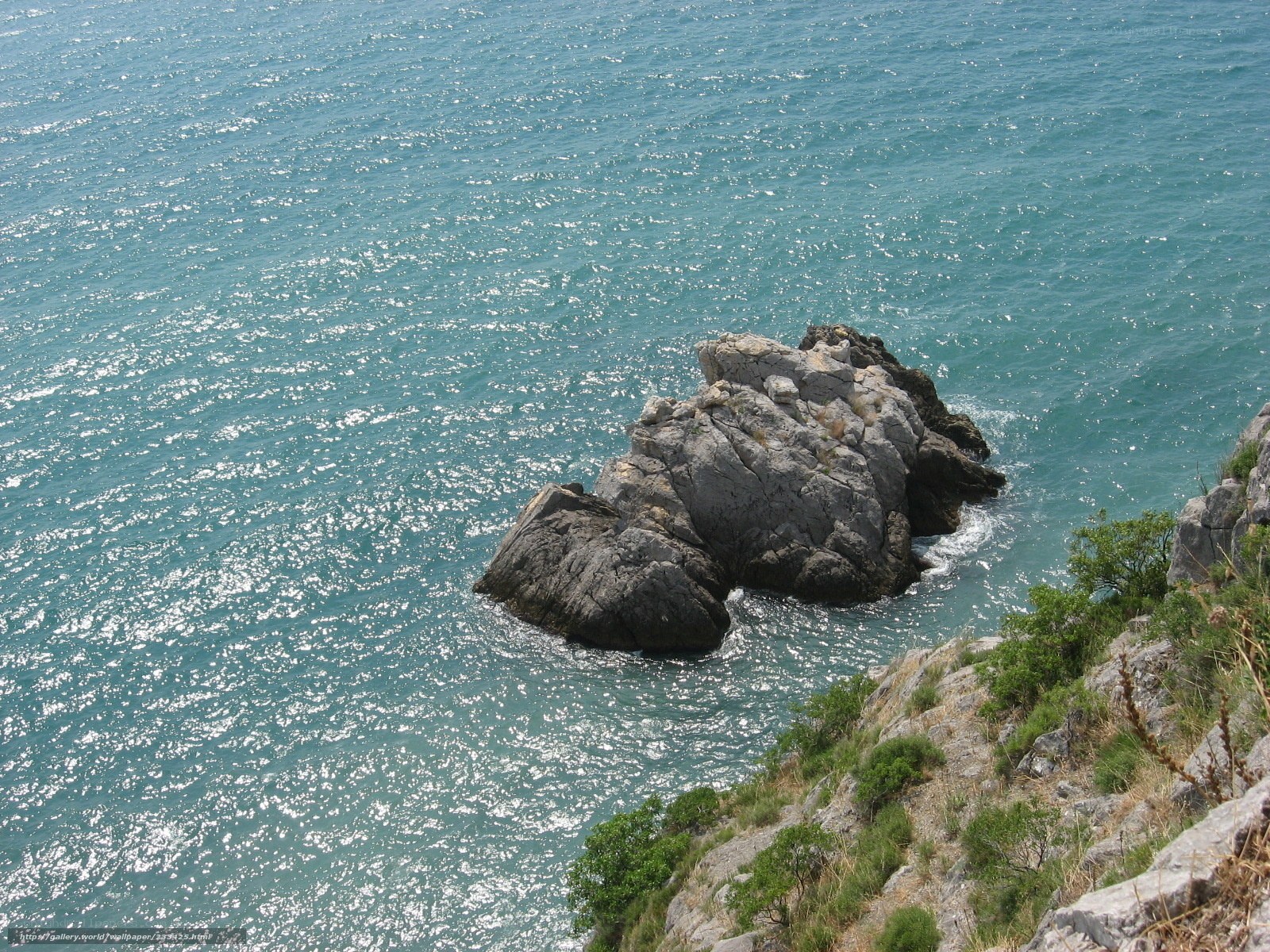Rocky outcrop in turquoise sea