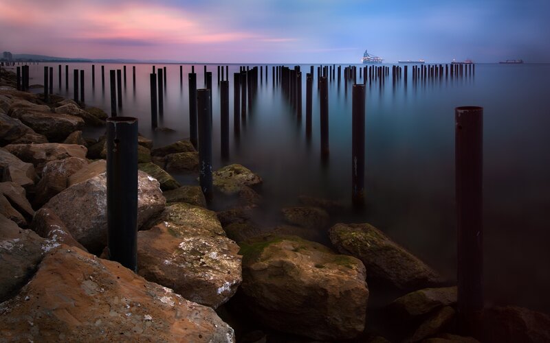 Rocky Pier at Dusk — Blue