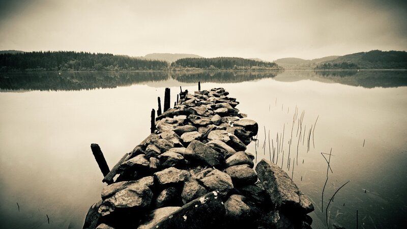 rocky pier on a calm lake