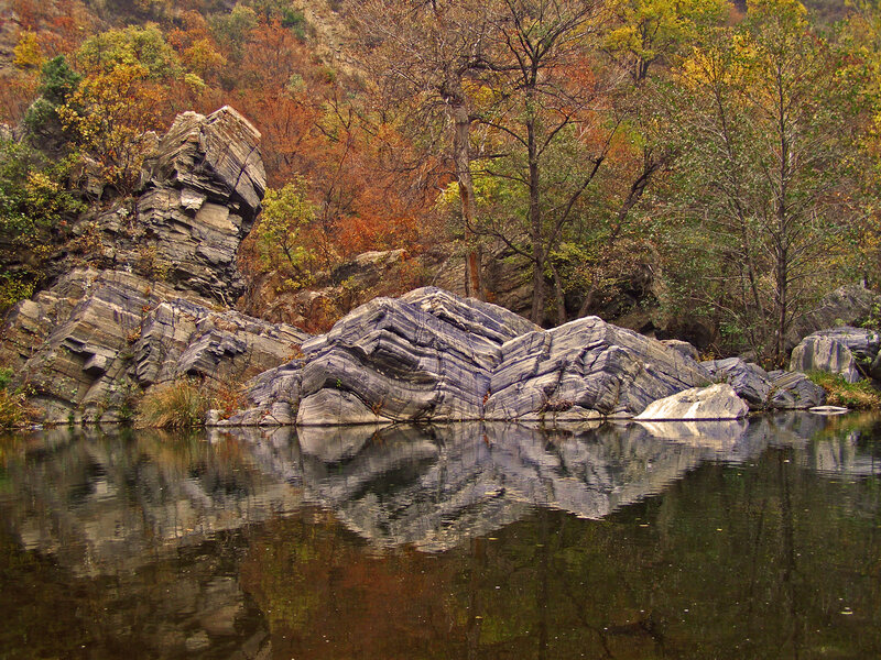 Rocky Riverbank in Autumn