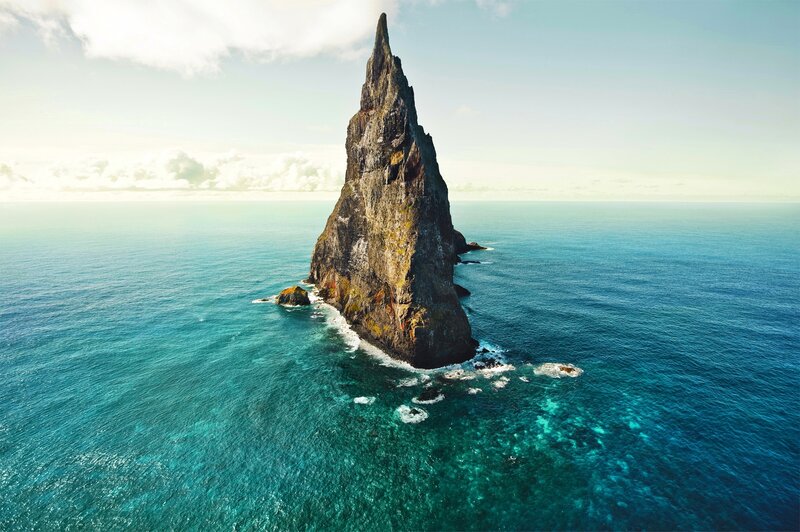 Rocky Sea Stack — Blue, Serene, Afternoon, Photograph