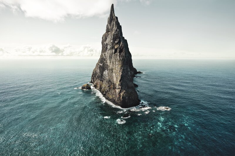 Rocky Sea Stack — Blue, Serene, Afternoon