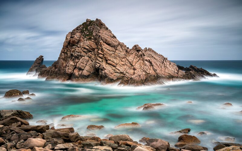 Rocky Sea Stack — Blue, Serene, Photograph