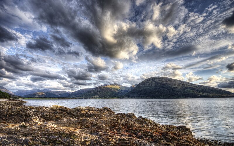 Rocky Shore and Mountains