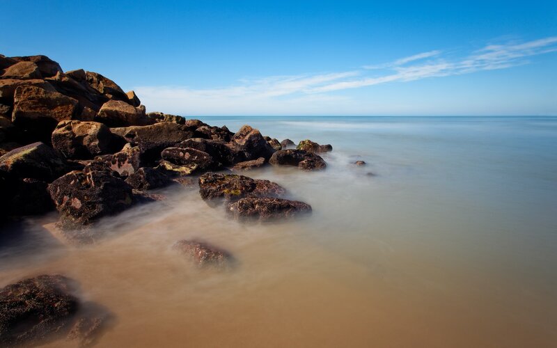 Rocky shore at calm sea