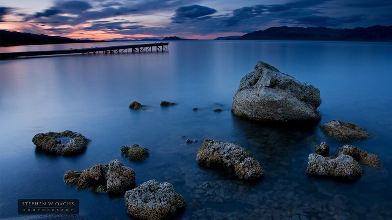 Rocky Shore at Dusk — Blue, Serene, Sunset, Photograph, Rocks, Pier