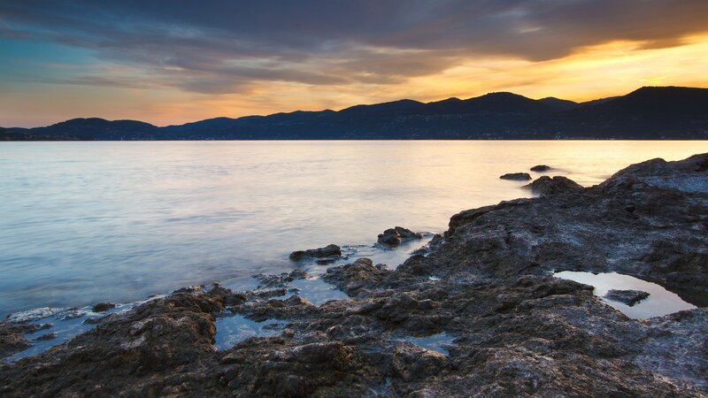 Rocky Shore at Sunset — Blue, Serene, Photograph, Sea, Mountains