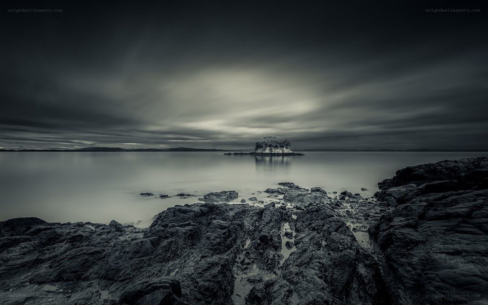 Rocky shore with distant island