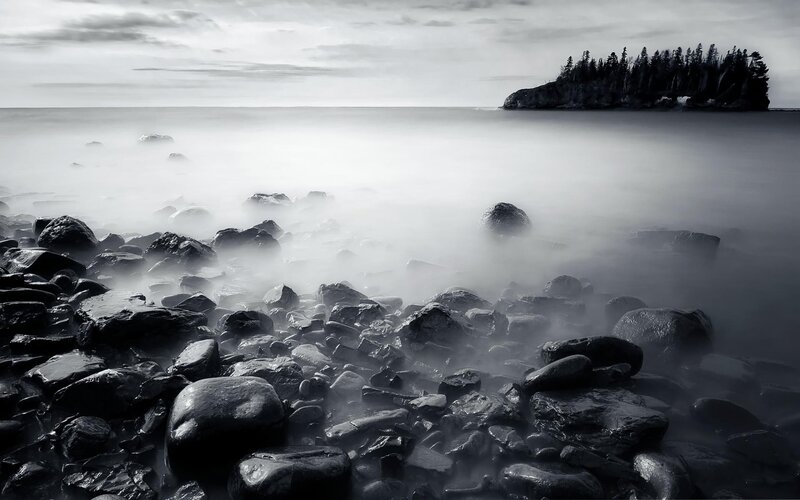 Rocky shore with misty sea